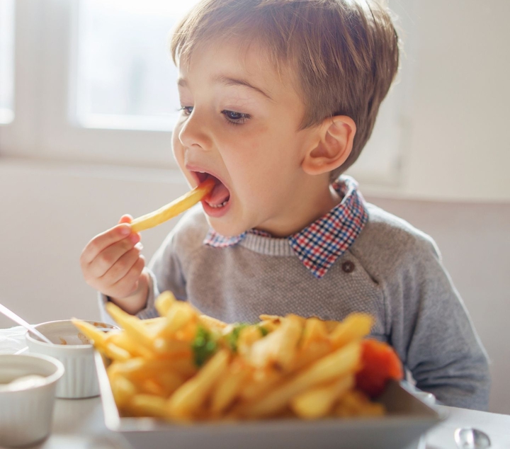 ClearView Boy eating chips